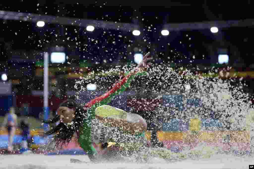 PatriCia Mamona of Portugal lands an attempt in the Women's triple jump at the World Athletics Indoor Championships in Belgrade, Serbia.