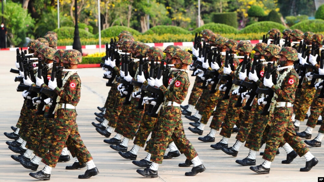 Members of the military march during a parade to commemorate Myanmar's 77th Armed Forces Day in Naypyitaw, Myanmar, March 27, 2022. 