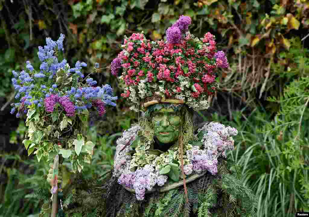 A participant attends the annual May Day bank holiday "Jack In The Green" parade and festival in Hastings, Britain.