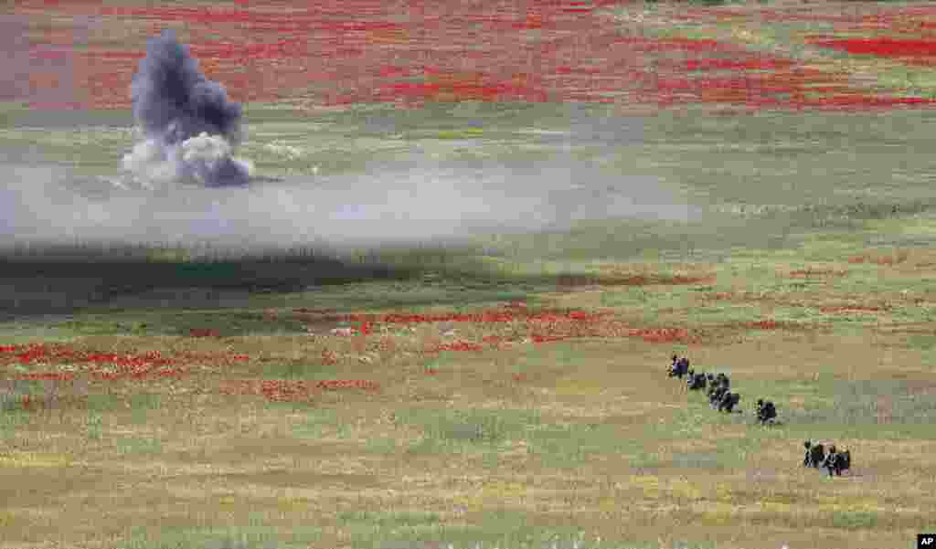 Soldiers from NATO countries take part in the Swift Response 22 military exercise at the Krivolak army training polygon in the central part of North Macedonia.