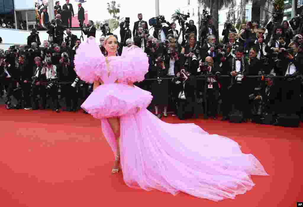 Leonie Hanne poses for photographers upon arrival at the premiere of the film 'Top Gun: Maverick' at the 75th international film festival, Cannes, southern France.
