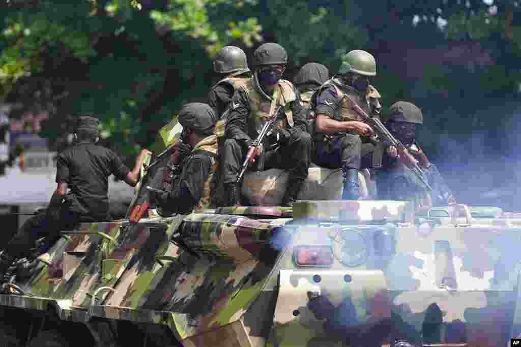 Sri Lankan army soldiers patrol during curfew in Colombo, Sri Lanka. Sri Lanka's defense ministry ordered security forces to shoot anyone causing injury to people or property to contain widespread arson and mob violence targeting government supporters.