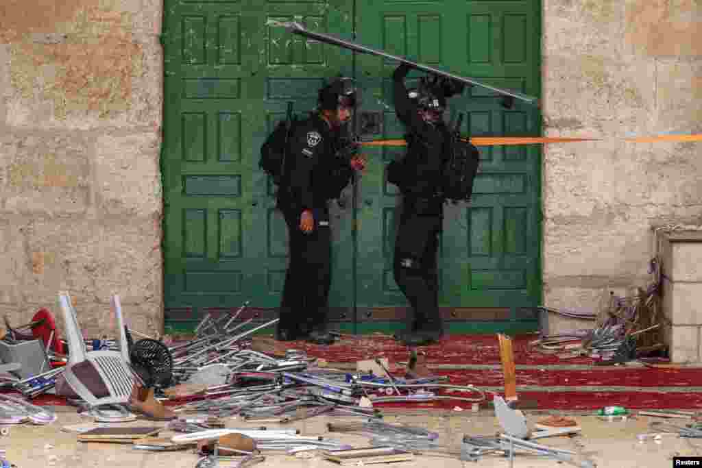 Israeli security forces secure a door at the compound that houses Al-Aqsa Mosque, known to Muslims as Noble Sanctuary and to Jews as Temple Mount, in Jerusalem's Old City.