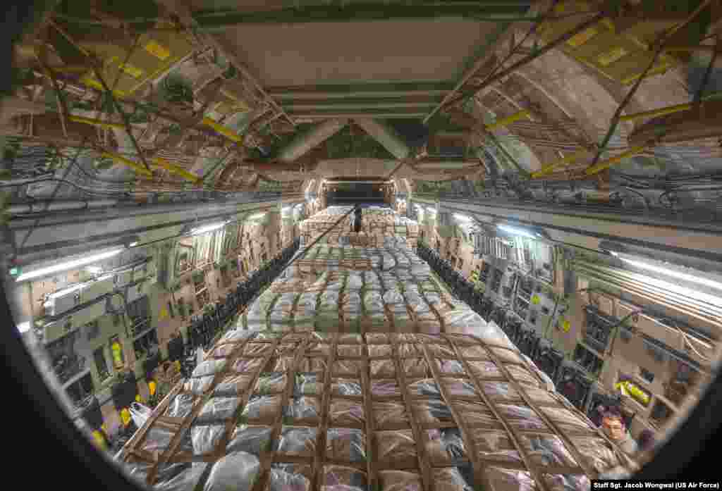Hundreds of boxes of infant formula arrived from Switzerland are loaded on a C-17 Globemaster III at Ramstein Air Base, Germany, May 22, 2022, for transport during Operation Fly Formula, an operation to quickly import infant formula to the United States that meets U.S. health and safety standards. 