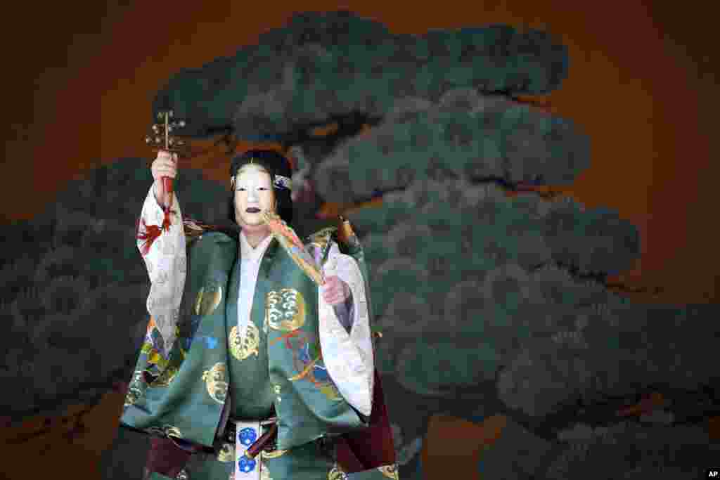 A dancer performs "Noh" dance-drama during a biennial festival called "Kanda Matsuri" at Kanda shrine in Tokyo.