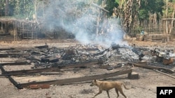 FILE - This photo from the humanitarian group Free Burma Rangers taken May 3, 2022, shows the remains of a building after attacks by the Myanmar military, according to the Free Burma Rangers, on a village in Doo Tha Htoo district in Myanmar's eastern Kayin state.