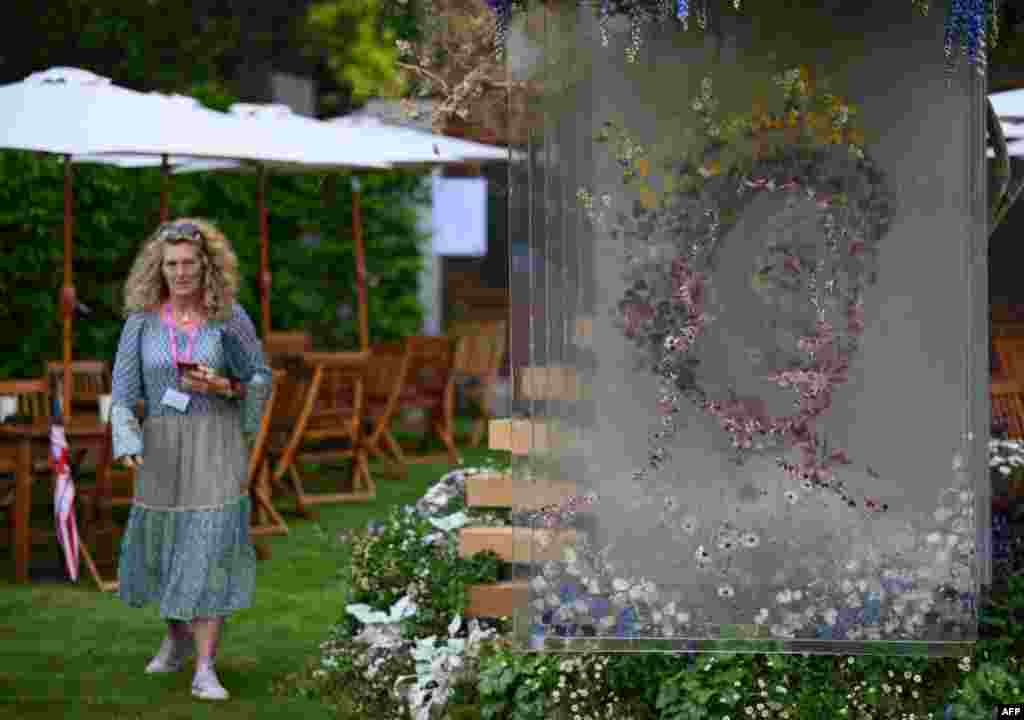 A display depicting an image of Britain's Queen Elizabeth II, ahead of her Platinum Jubliee, is pictured at the Veevers Carter garden during the 2022 RHS Chelsea Flower Show in London.