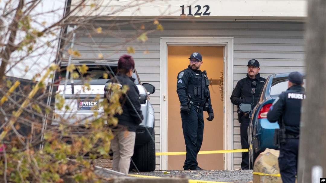 Officers investigate a homicide at an apartment complex south of the University of Idaho campus on Sunday, Nov. 13, 2022. 