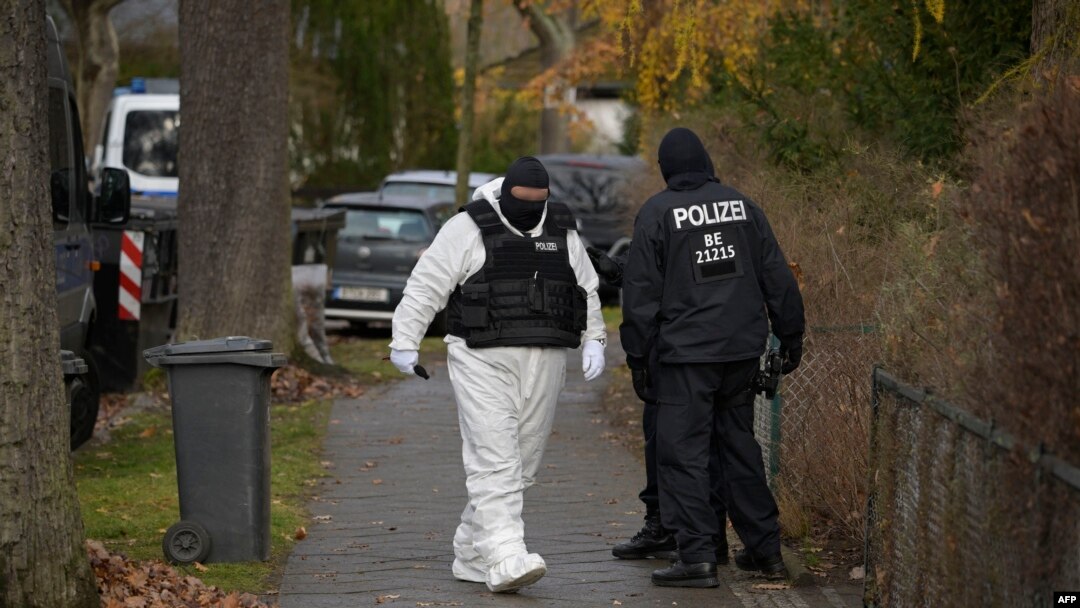 FILE - Police officers are seen in a street during a raid against members of a far-right group suspected of plans to overthrow the government, in Berlin, Germany, Dec. 7, 2022.