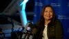 U.S. Sen. Tammy Duckworth smiles on stage with supporters at her victory party at Adler Planetarium in Chicago, IL. Nov 8, 2022.
