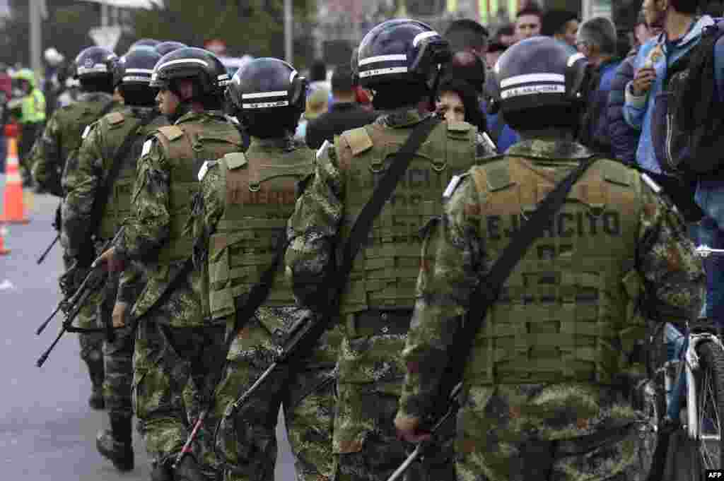 Members of the security forces patrol around the site of an explosion on a police cadet training school in Bogota, Colombia, on Jan. 17, 2019.