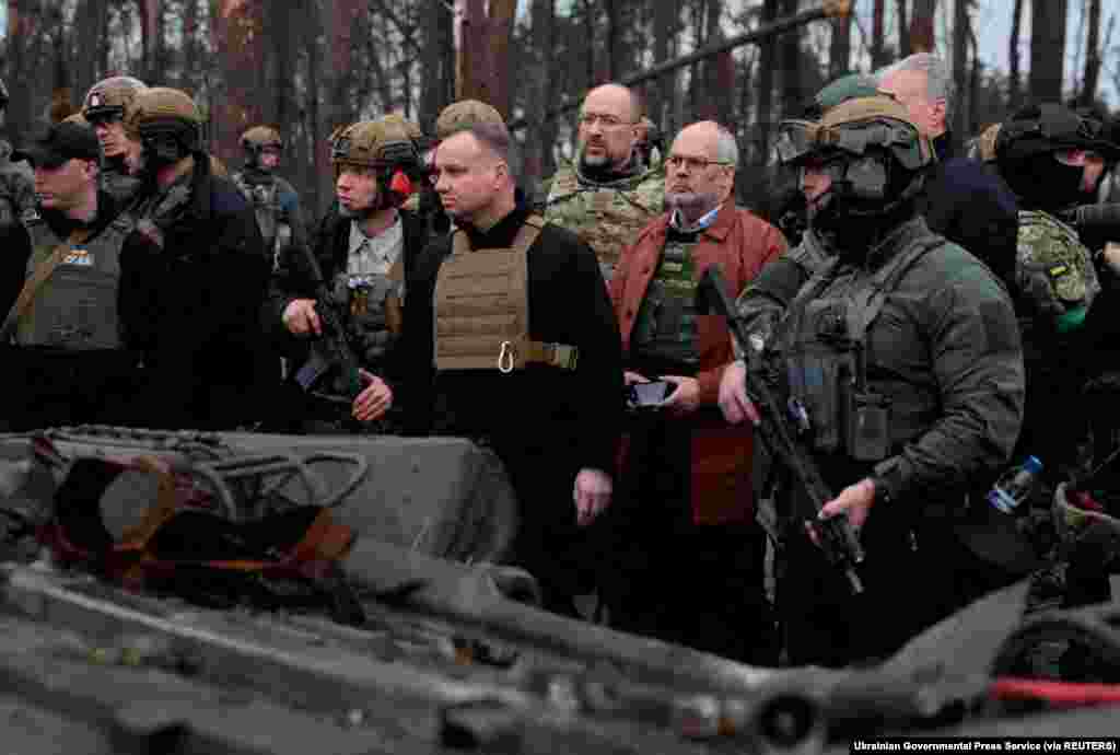 Lithuanian President Gitanas Nauseda, Polish President Andrzej Duda, Latvian President Egils Levits, Estonian President Alar Karis and Ukraine's Prime Minister Denys Shmyhal visit the village of Dmytrivka in Kyiv region, Ukraine, as Russia's attack on Ukraine continues, April 13, 2022.
