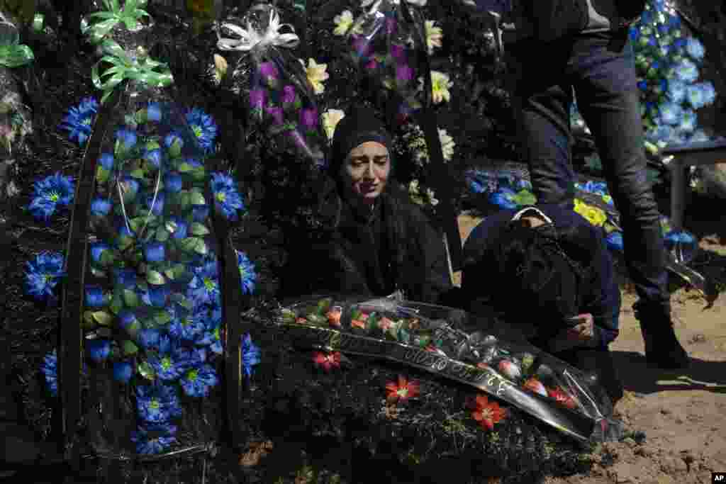 The sister and mother of Ukrainian soldier mourn his death after he was killed by Russian forces in Irpin on the outskirts of Kyiv, Ukraine.