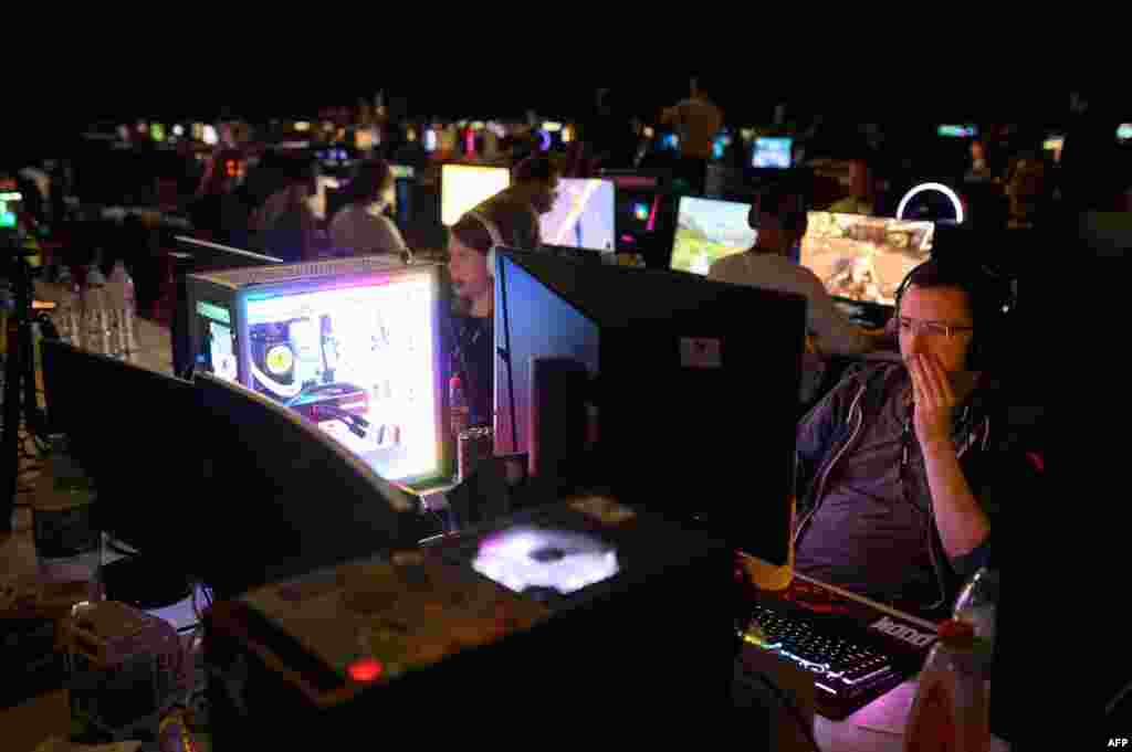 Members of the gaming community compete during the four-day Insomnia Gaming Festival at the NEC in Birmingham, central England. The festival is set to attract 40,000 visitors and will host the UK's largest LAN (Local Area Network) competitions in their Bring Your Own Computer area where 2,800 gamers will be able to enjoy non-stop, 24-hour gaming. 