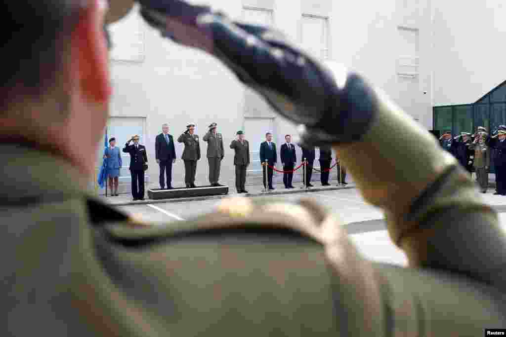 Members of the European armies listen to the European Union anthem during the transfer of authority of leadership of the European Union Atalanta Operation from UK to Spain, at the naval airbase in Rota, near Cadiz, southern Spain.