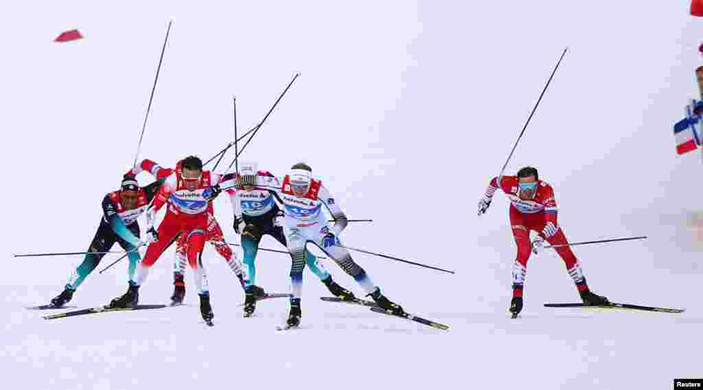 Emil Iversen of Norway, Oskar Svensson of Sweden and Gleb Retivykh of Russia compete during the semifinals of the Men's sprint during the FIS Nordic World Ski Championships in Seefeld, Austria.