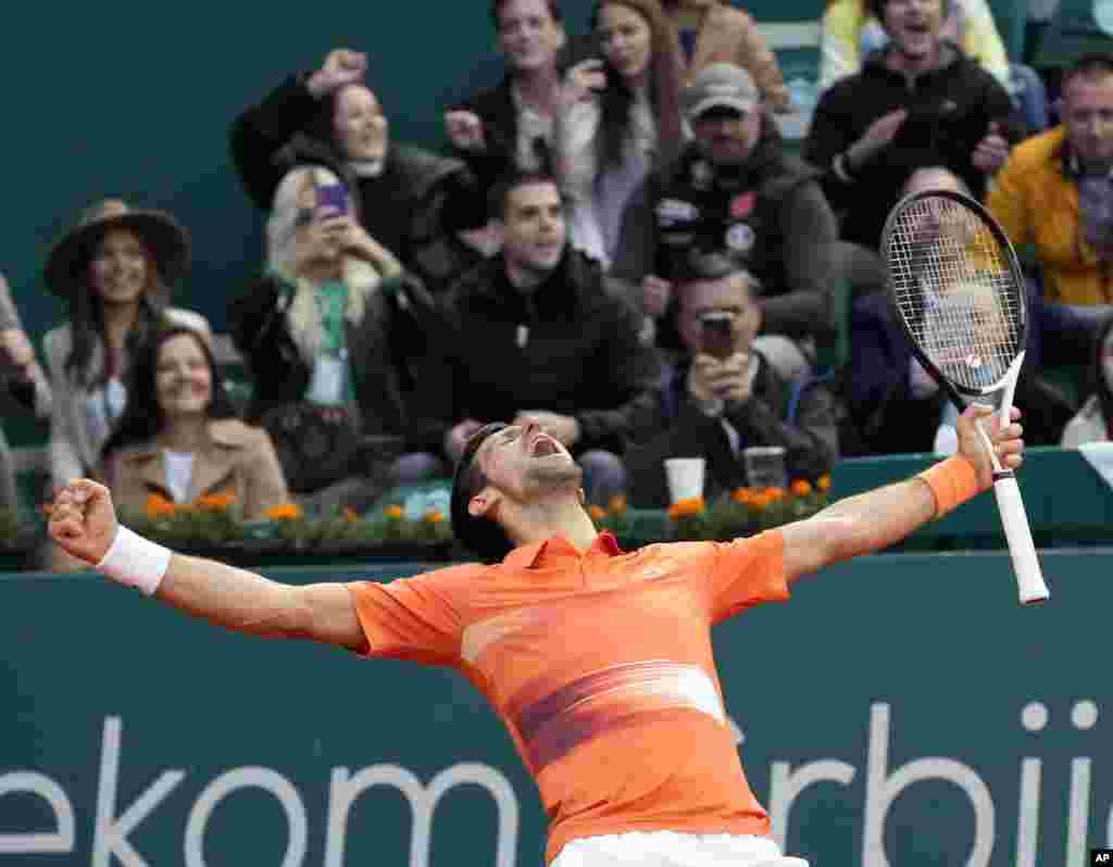 Novak Djokovic of Serbia celebrates at the end of his quarterfinal tennis match against Miomir Kecmanovic of Serbia, at the Serbia Open tennis tournament in Belgrade.