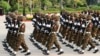 FILE - Members of the Myanmar military march during a parade to commemorate Myanmar's 77th Armed Forces Day in Naypyitaw, Myanmar, March 27, 2022. 