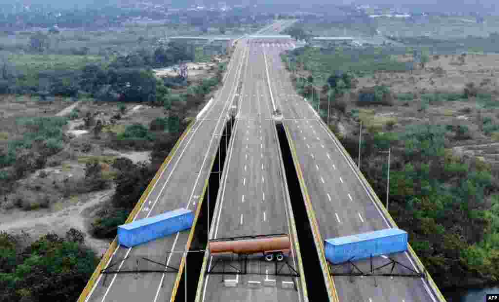 Venezuelan military forces block the Tienditas Bridge, in the border between Cucuta, Colombia and Tachira, Venezuela, with containers. Venezuela blocked the bridge ahead of an anticipated humanitarian aid shipment, as opposition leader Juan Guaido stepped up his challenge to President Nicolas Maduro's authority.