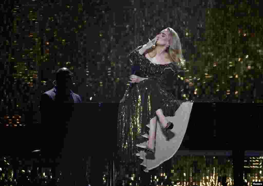 Adele performs at the Brit Awards at the O2 Arena in London, Feb. 8, 2022. Chart-topping superstar Adele won the top three prizes at the BRIT Awards, in the first genderless edition of Britain's annual pop music honors.