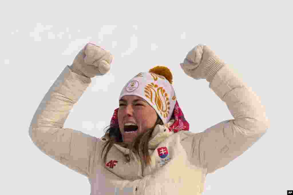 Petra Vlhova of Slovakia celebrates during the medal ceremony after winning the gold medal in the women's slalom at the 2022 Winter Olympics in the Yanqing district of Beijing.
