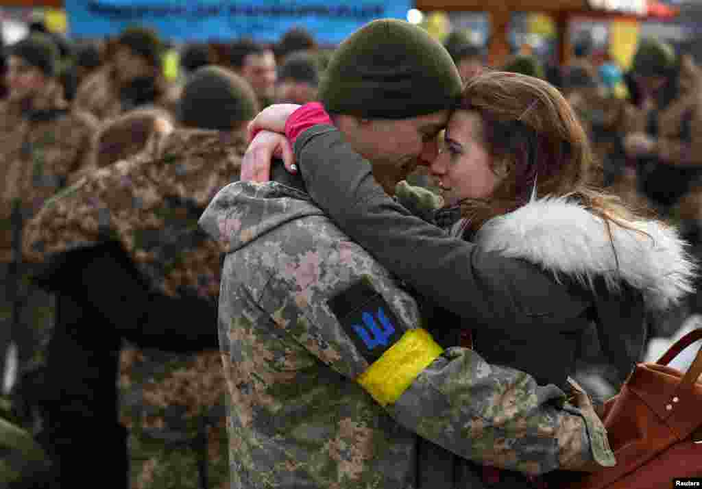 Olga hugs her boyfriend Vlodomyr as they say goodbye prior to Vlodomyr’s deployment closer to the front line, amid Russia's invasion of Ukraine, at the train station in Lviv, Ukraine.