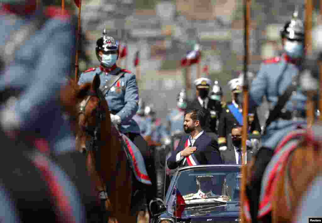 Chile's President Gabriel Boric gestures, after being sworn in at the Congress, in Valparaiso, Chile.