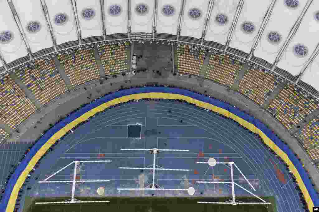 A 200-meter-long Ukrainian flag is unfolded at the Olympiyskiy stadium in Kyiv, Ukraine. As Western officials warned a Russian invasion could happen as early as today, President Zelenskyy called for a Day of Unity, encouraging citizens to raise Ukrainian flags across the country.