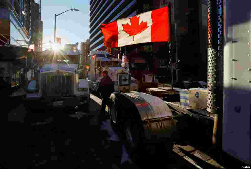 Trucks block a downtown road as truckers and their supporters continue to protest against COVID-19 vaccine mandates in Ottawa, Ontario, Canada, Feb. 15, 2022.