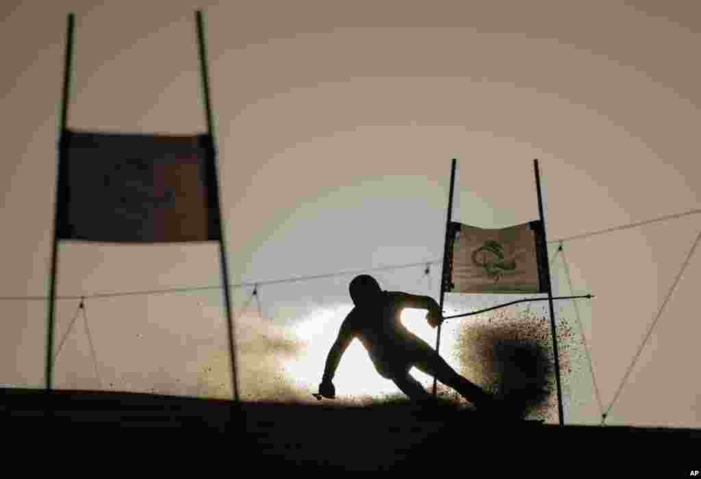 Jeffrey Stuut of the Netherlands (LW3) is seen silhouetted as he competes in the men's Giant Slalom Standing Para Alpine Skiing event at the Yanqing National Alpine Skiing Center during the Beijing Winter Paralympic Games in Yanqing, China.