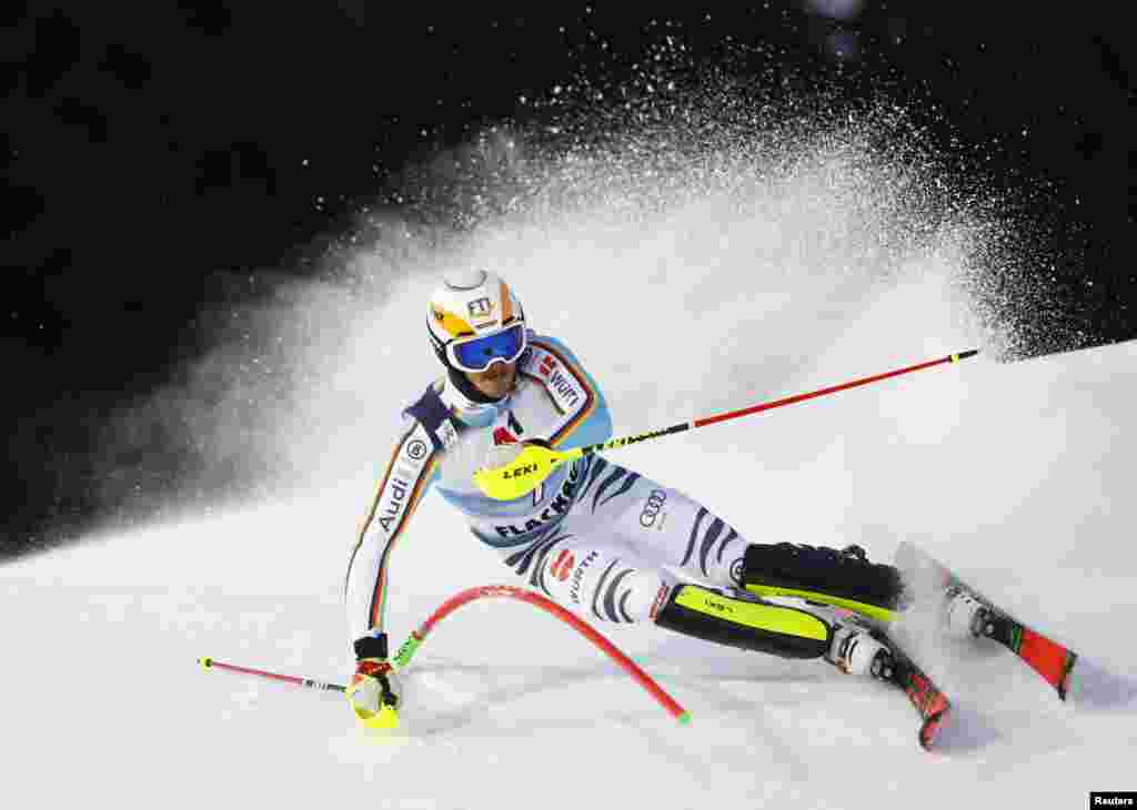 Linus Strasser of Germany speeds down the course in the men's night slalom race during the FIS Alpine Ski World Cup in Flachau, Austria.