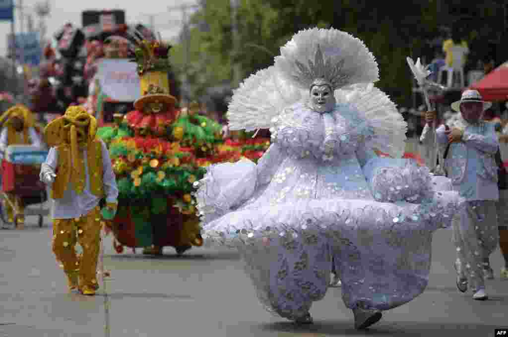 Revelers perform in the Battle of Flowers parade as part of Barranquilla's Carnival, Colombia, March 26, 2022.