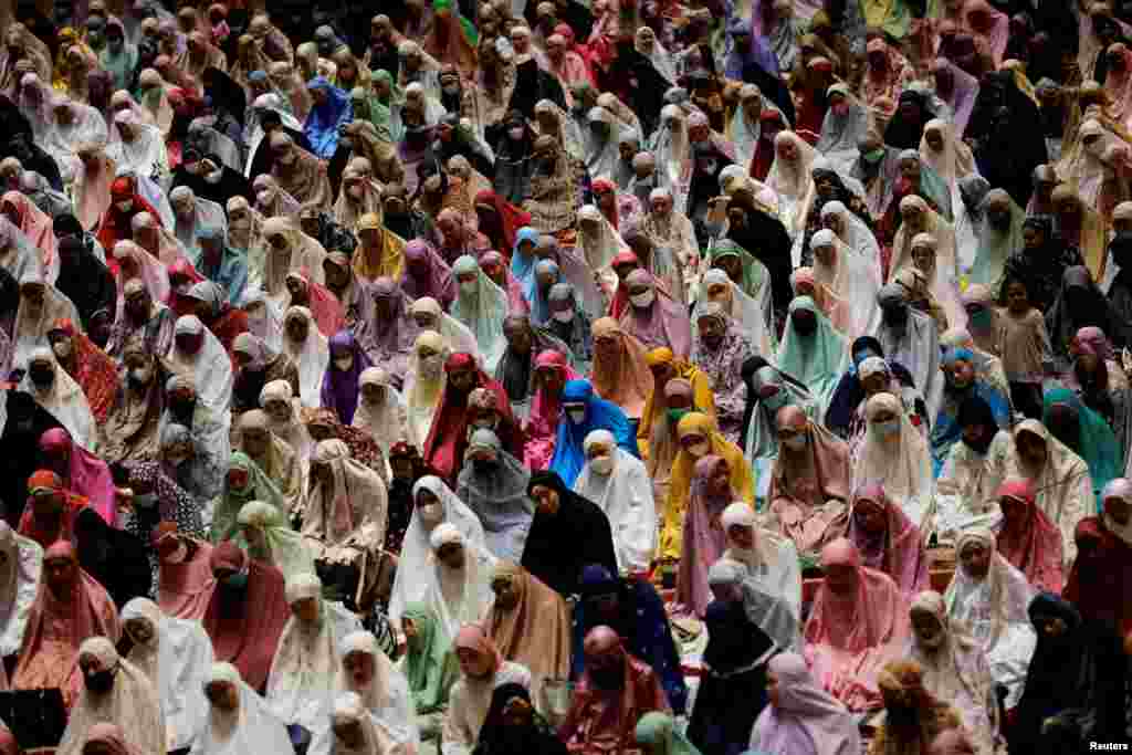 Muslim women offer evening mass prayers known as 'Tarawih' during the first eve of holy fasting month of Ramadan at the Great Mosque of Istiqlal in Jakarta, Indonesia, April 2, 2022.