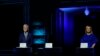 Presidential candidates Danuse Nerudova, left, and Petr Pavel wait for the start of a political debate at the National Museum in Prague, Czech Republic, Jan. 8, 2023. 