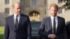 FILE - Britain's Prince William, Prince of Wales, left and Prince Harry walk to meet members of the public at Windsor Castle, in Windsor, England, Sept. 10, 2022. In his new book "Spare," Harry talks about his struggles as well as his life as a royal and "spare" to the throne.