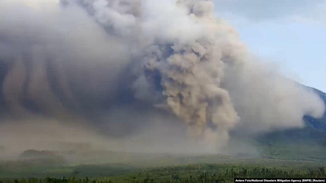Mount Semeru volcano erupts as seen from Lumajang, East Java province, Indonesia, Dec. 4, 2022. 