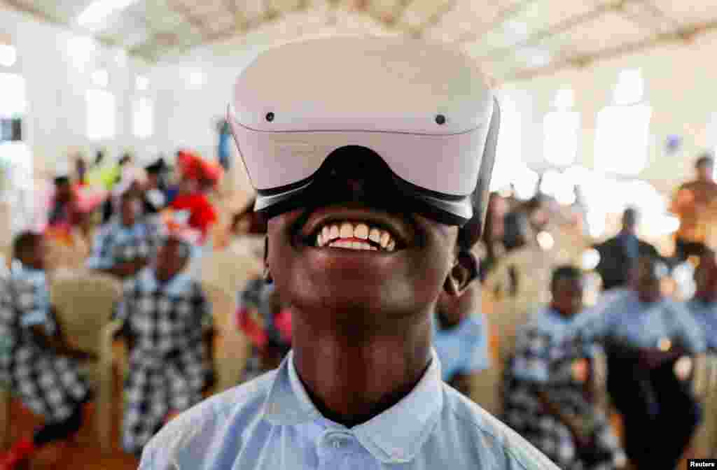 Francis Mwangi, 13, uses an Oculus virtual reality (VR) headset, to virtually visit Buckingham Palace during the celebration of Britain's Queen Elizabeth's Platinum Jubilee, in Nyeri, Kenya.
