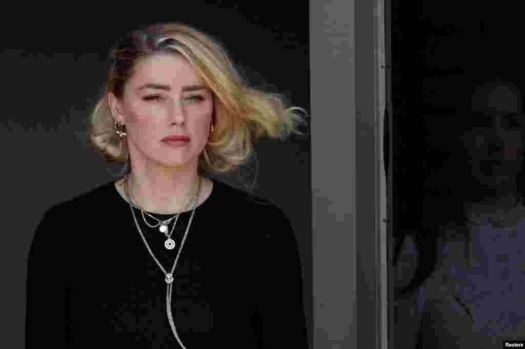 Amber Heard leaves Fairfax County Circuit Courthouse after the jury announced split verdicts in favor of both her ex-husband Johnny Depp and Heard on their claim and counter-claim in the Depp v. Heard civil defamation trial at the Fairfax County Circuit Courthouse in Fairfax, Virginia, June 1, 2022.