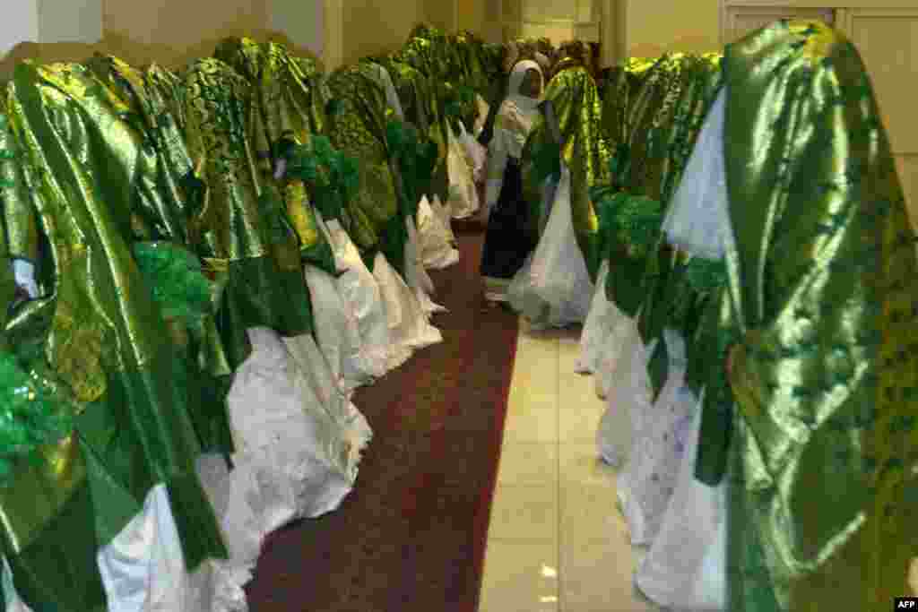 Brides wait for the start of a mass marriage ceremony inside a wedding hall in Kabul, Afghanistan.