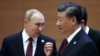 FILE - Russian President Vladimir Putin speaks with Chinese President Xi Jinping at the Shanghai Cooperation Organization summit in Samarkand, Uzbekistan, Sept. 16, 2022. (Sergei Bobylev, Sputnik, Kremlin Pool Photo via AP)