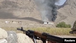 A still image from video released Sept. 16, 2022 by the Kyrgyz border guard service, shows what it said to be active military confrontation on Kyrgyz-Tajik border in the Batken region, Kyrgyzstan. 