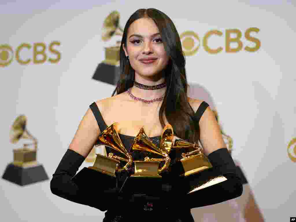 Olivia Rodrigo, winner of the awards for best pop vocal album for "Sour," best new artist and best pop solo performance for "Drivers License," poses in the press room at the 64th Annual Grammy Awards at the MGM Grand Garden Arena, April 3, 2022, in Las Vegas.