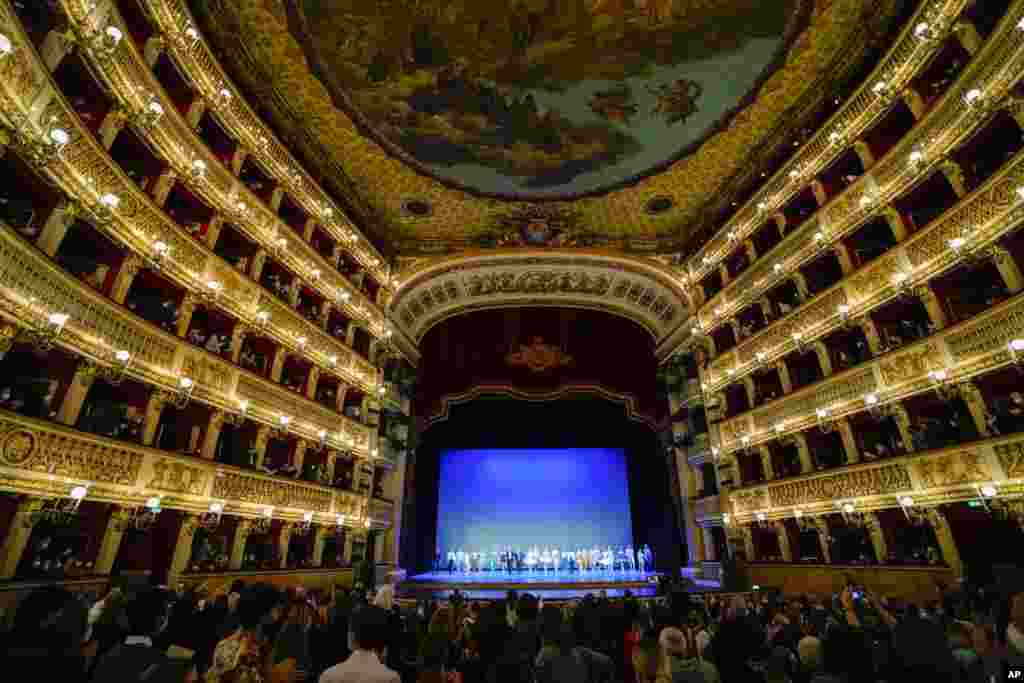 Ballet dancers acknowledge the applause at the end of their performance at the Naples' San Carlo opera house, Italy, April 4, 2022. Ukrainian and Russian dancers took part in a benefit show to raise funds for the Red Cross and champion the cause of peace in Ukraine.