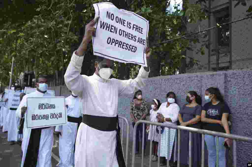 Catholic clergy protest against the economic crisis in Colombo, Sri Lanka. A group of Sri Lankan governing party lawmakers called for the appointment of an interim government as demonstrators continue to demand the resignation of President Mahinda Rajapaksa over the country’s worst economic crisis in decades.