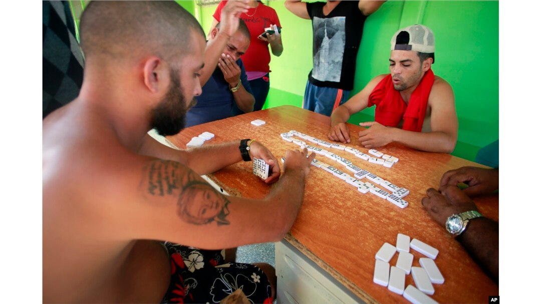 Cuban migrants play dominoes to pass the time at a temporary shelter in La Cruz, Costa Rica, Jan. 12, 2016.