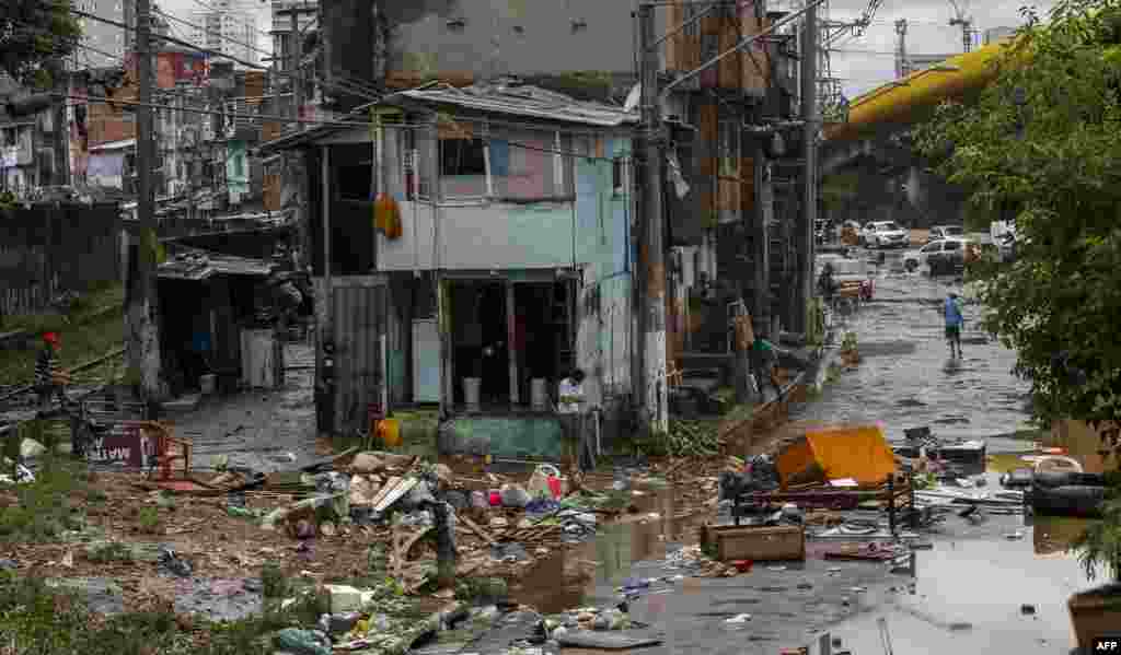 View of damaged caused by torrential rains in a street of Sao Paulo, Brazil.