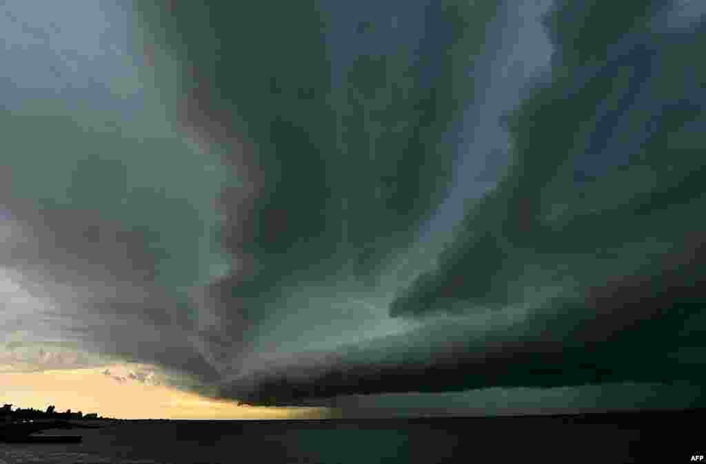 Dark clouds and a heavy rain approach Montevideo from the Rio de la Plata, Uruguay, Jan. 7, 2014.