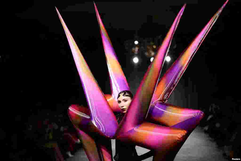 A model presents a creation during the "On/Off presents Jack Irving" catwalk show at London Fashion Week in London, Britain.
