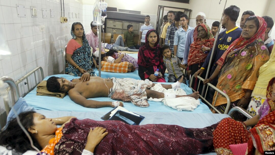 People who sustained injuries in a series of blasts are surrounded by their relatives at a hospital in Dhaka, Oct. 24, 2015.