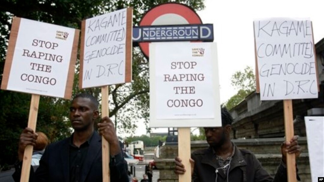 Protesters stand outside Arundel House where President of the Republic of Rwanda, Paul Kagame, deliverers the annual Oppenheimer Lecture, London, Sept. 16, 2010.
